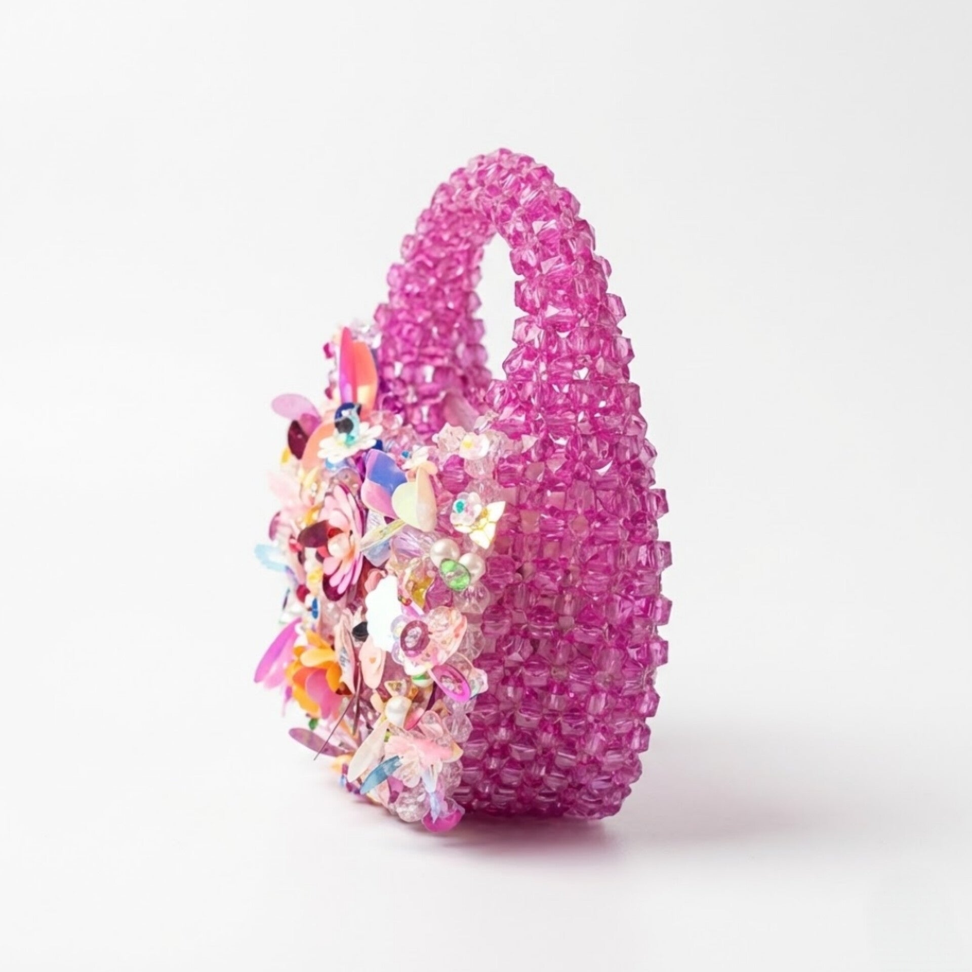 Handmade pink crystal beaded mini handbag with pearl, shell and floral embellishments by Duchess Beads Ghana.