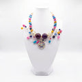 Luxury handmade colourful beaded statement necklace with floral crystal pendant handcrafted in Ghana by Duchess Beads.