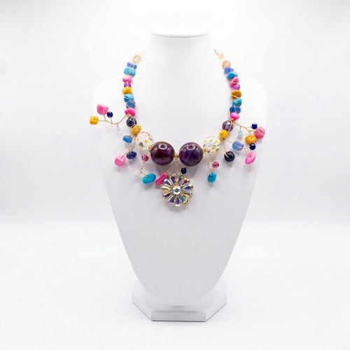 Luxury handmade colourful beaded statement necklace with floral crystal pendant handcrafted in Ghana by Duchess Beads.