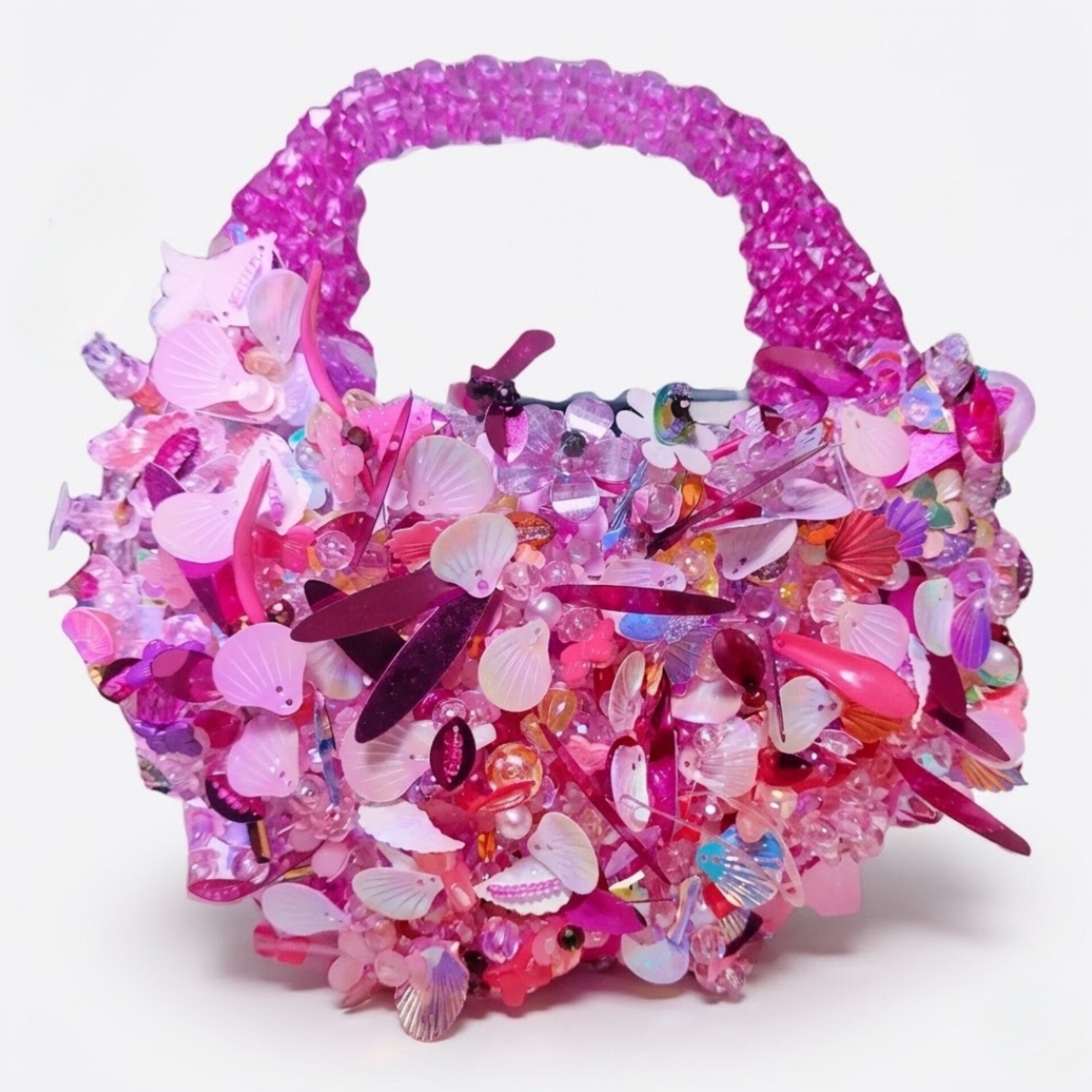 Handmade pink crystal beaded mini handbag with pearl, shell and floral embellishments by Duchess Beads Ghana.