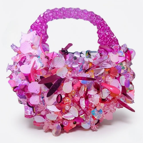 Handmade pink crystal beaded mini handbag with pearl, shell and floral embellishments by Duchess Beads Ghana.