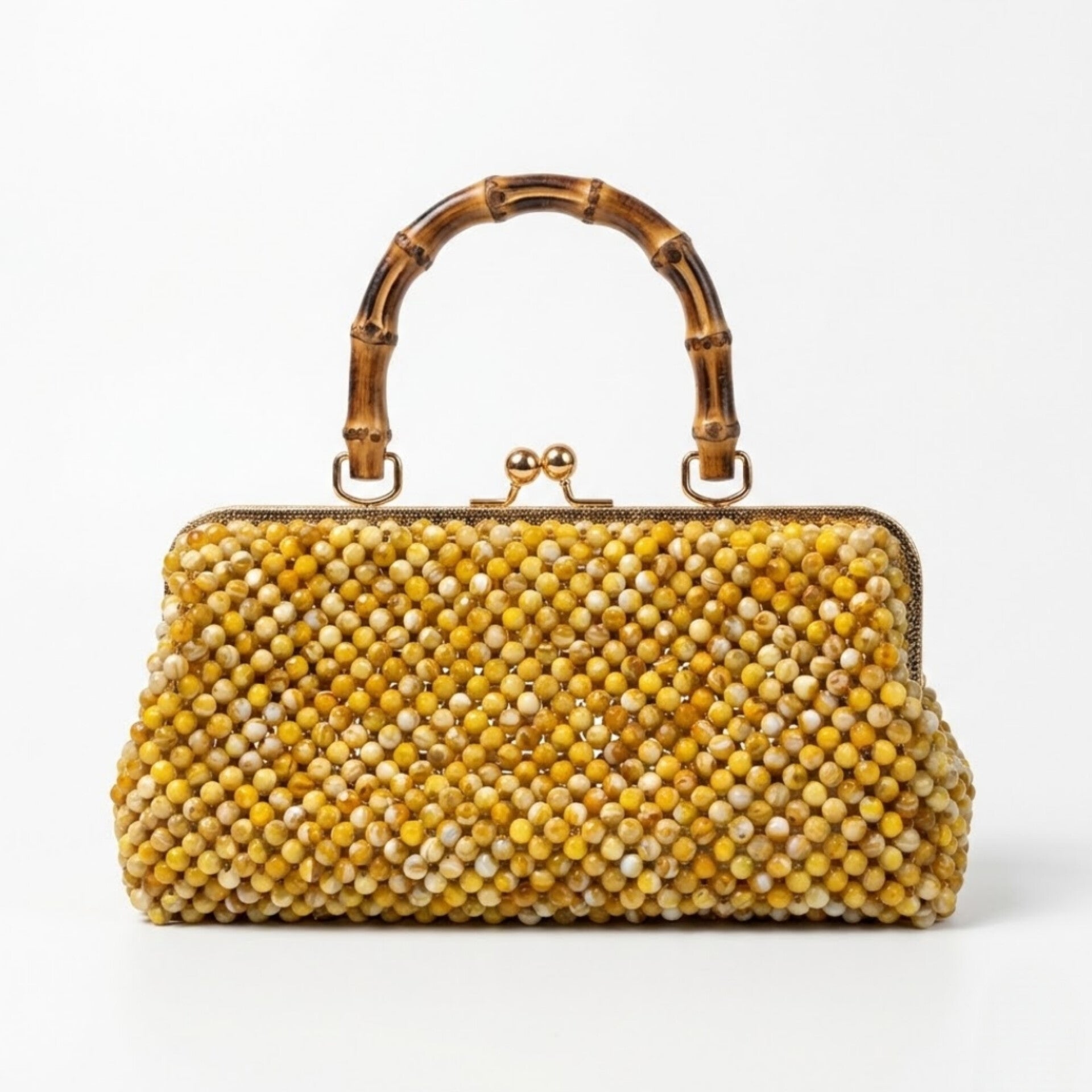 Luxury handmade golden pearl beaded bamboo handle clutch handcrafted in Ghana by Duchess Beads with gold kiss-lock closure.